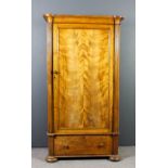 A 19th Century French satin walnut armoire with splayed cornice enclosed by a single panelled