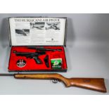 A Webley .22 caliber 1982 Hurricane air pistol in original box with paperwork, pellets, scope