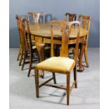 A 1920s oak oval extending dining table with one extra leaf for same, moulded edge and plain