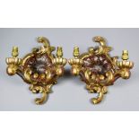 A pair of German carved giltwood and silvered two-branch electric wall lights, with rococo pattern