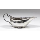 A George III silver oval sauce/cream boat of plain form with scroll handle and on oval footrim, 2.
