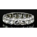 A modern silvery coloured metal all diamond set full hoop eternity ring, the face set with sixteen
