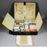 An L.M.S black japanned metal rectangular first aid box, complete with some contents and British