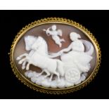 A late 19th Century 9ct gold mounted oval cameo brooch, the shell cameo carved in high relief with a