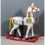 A 20th Century white painted rocking horse, painted with shepherd and gypsy caravans, on red painted