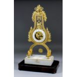 An early 19th Century French gilt brass cased lyre pattern mantel timepiece, the 3.75ins diameter