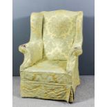 A 19th Century wingback easy armchair with loose old gold covers, on square legs and plain