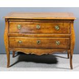 An 18th Century Continental fruitwood commode of slightly serpentine outline, the plain top with