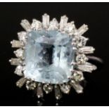 A modern silvery coloured metal mounted aquamarine and diamond ring, the square cut aquamarine of