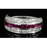A modern platinum mounted ruby and diamond half hoop eternity ring, the face channel set with