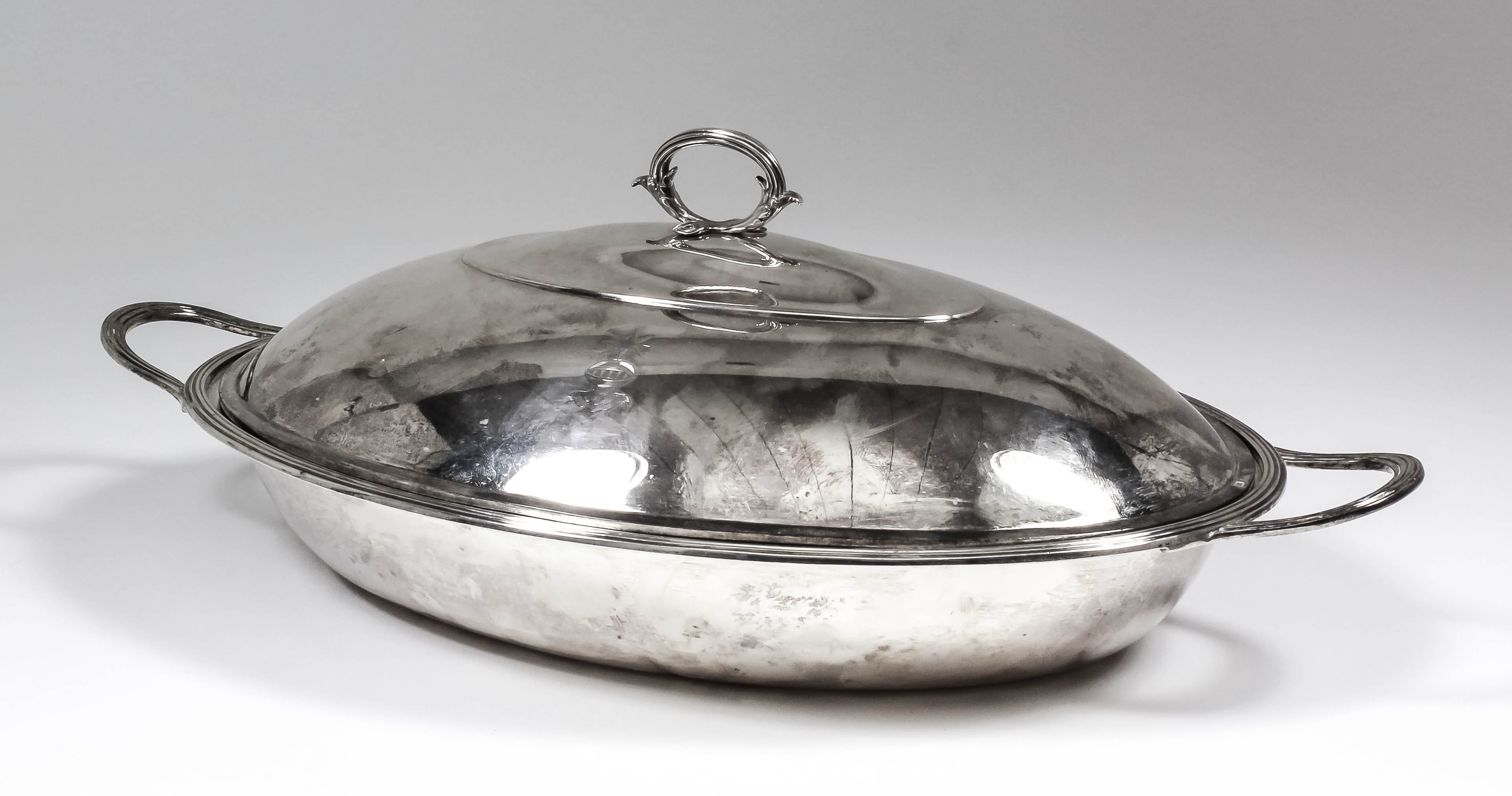 A George III silver oval two-handled entree dish and associated cover with reeded mounts and