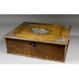 An oak and plated mounted rectangular workbox, the panelled lid applied with plaque embossed with