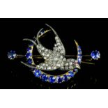 A late Victorian gold coloured metal mounted sapphire and diamond set bluebird pattern brooch,