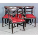 A set of four late George III mahogany dining chairs (including one armchair), with curved crest