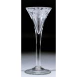 An 18th Century wine glass, the trumpet bowl engraved with fruiting vine, on plain stem and foot,