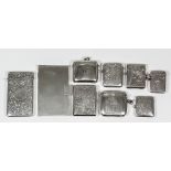 An Edward VII silver rectangular card case engraved with circular cartouche and leaf scroll