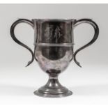 @A George III silver two-handled urn pattern cup with moulded rim and girdle, with s-scroll