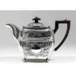 A George III silver rectangular teapot with gadroon mounts, embossed and engraved with floral,