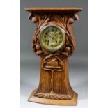 An early 20th Century "Scottish" carved oak cased "Spinningdale" mantel clock, the 4ins diameter