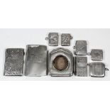 An Edward VII silver rectangular purse/card case engraved with leaf scroll ornament, with cloth