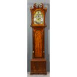 An 18th Century mahogany longcase clock by Robert Jones of Chester, the 12ins arched brass dial with