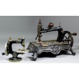 A late 19th/early 20th Century McGrah "Triumph" cast iron table sewing machine painted in black with