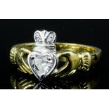 A modern 18ct white and yellow gold mounted diamond set Claddagh ring, the central heart cut diamond