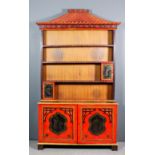 A 1920s/30's red Japanned dresser in the "Chinese Chippendale" manner, the whole decorated in gilt