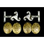A pair of modern gentleman's 15ct gold oval pattern cufflinks, the faces with floral and foliate
