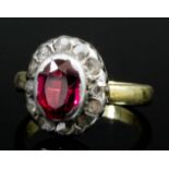 A late Georgian gold and silvery coloured metal mounted spinel and diamond ring, the oval cut spinel