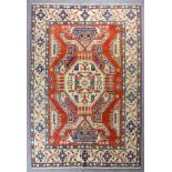 A modern Turkish carpet woven in the "Kazak" manner, in pastel colours with a bold central octagonal