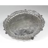 A Victorian silver circular salver, the shaped rim pierced and cast with scrollwork, the centre