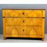 A 19th Century Continental walnut and ebonised commode in the "Biedermeier" style, with plain top,