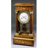 A 19th Century French rosewood, marquetry and gilt metal mounted mantel clock of "Empire" design, by