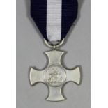 A George VI Distinguished Service Cross (unnamed), in Garrard & Co Ltd. black leather covered case