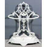 A white painted cast iron stick/umbrella stand, the back pierced and cast with vase of flowers and