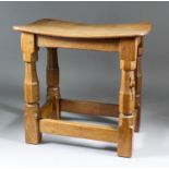 A Robert "Mouseman" Thompson of Kilburn oak dished-top rectangular stool, 15.5ins x 10.5ins x 14.