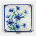 An Elizabeth II silver and enamel square compact, the lid enamelled with blue cornflowers, on a