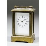 A late 19th/early 20th Century French miniature carriage timepiece, the white enamel dial with Roman