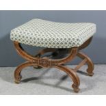 A Victorian walnut framed rectangular stool, the dished seat upholstered in blue and cream cloth, on