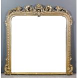 A Victorian giltwood framed oval mantel mirror (late painted), with leaf scroll carved cresting,