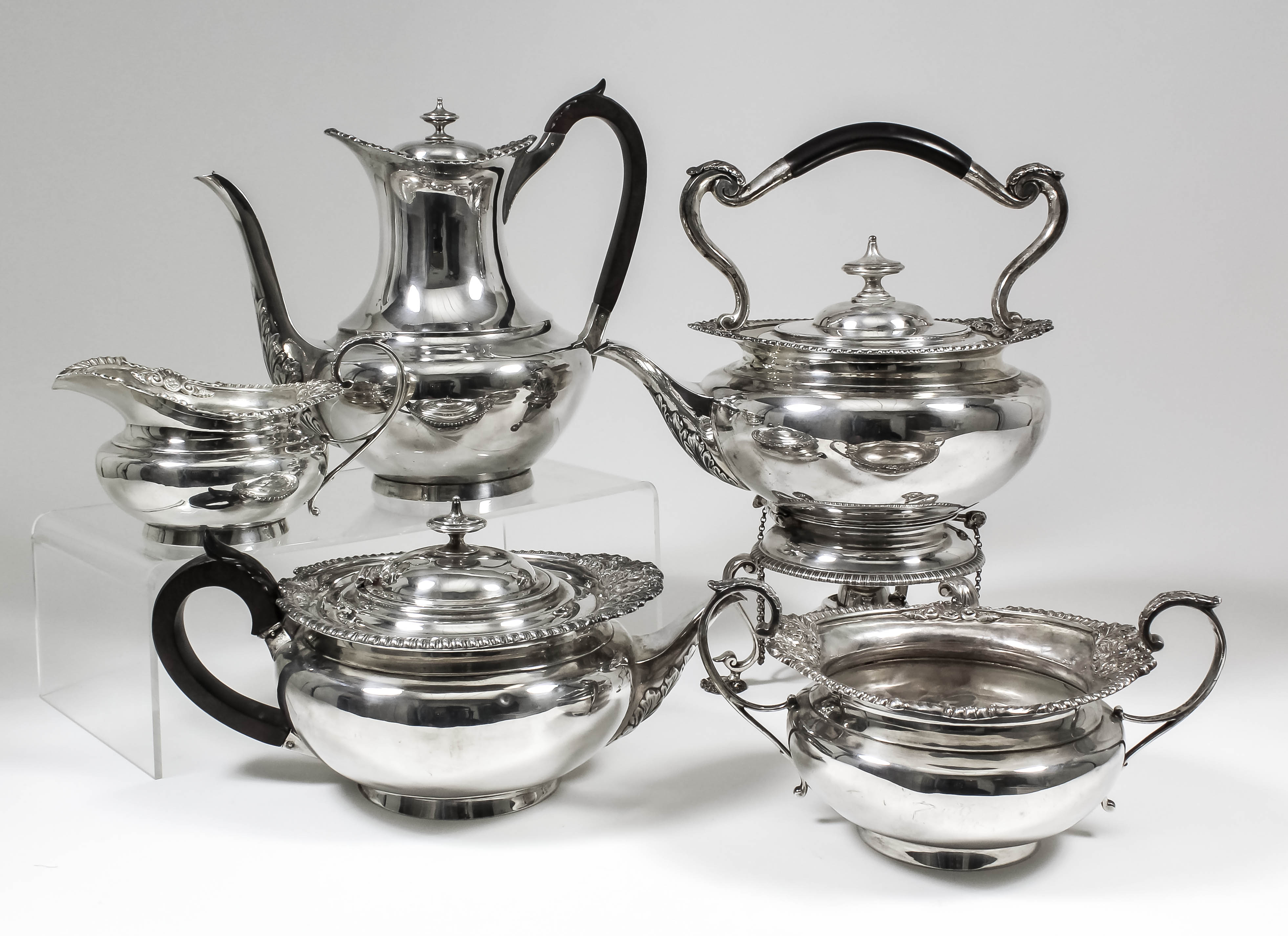 A late Victorian and Edward VII silver five piece tea and coffee service of Georgian design, the