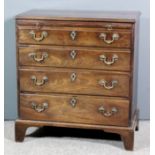 A George III mahogany chest of small proportions with moulded edge to top, fitted with a brushing