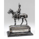 An early 20th Century plated equestrian presentation model of a mounted hussar on ebonised stepped
