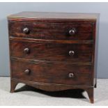 A late Georgian mahogany bow front chest with twin reeded edge to top, fitted three long drawers