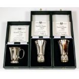 Two Elizabeth II silver "Millennium" beakers of tapered form, each 4ins high, No's 108 and 109 of