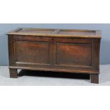 A late 17th Century panelled oak coffer with moulded rails and twin panelled lid and front, 50ins