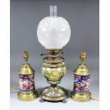 A late 19th Century pottery oil lamp with gilt metal fittings, the body enamelled in colours and