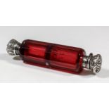 A late Victorian silver mounted and cranberry glass double ended cylindrical scent bottle, with