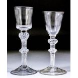 Two 18th Century wine glasses, both with plain bucket bowls and on twin knopped air twist stems,